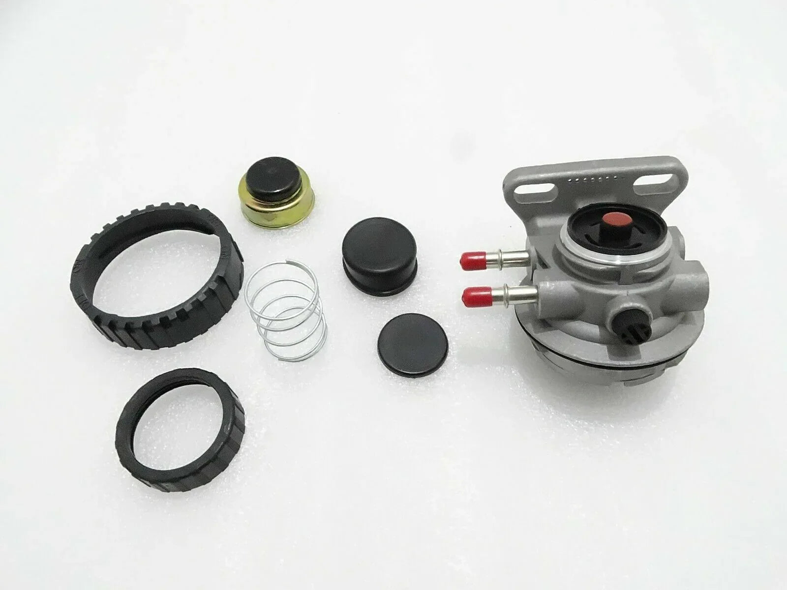 Hand primer kit components with pump head, fittings, rings, and spring