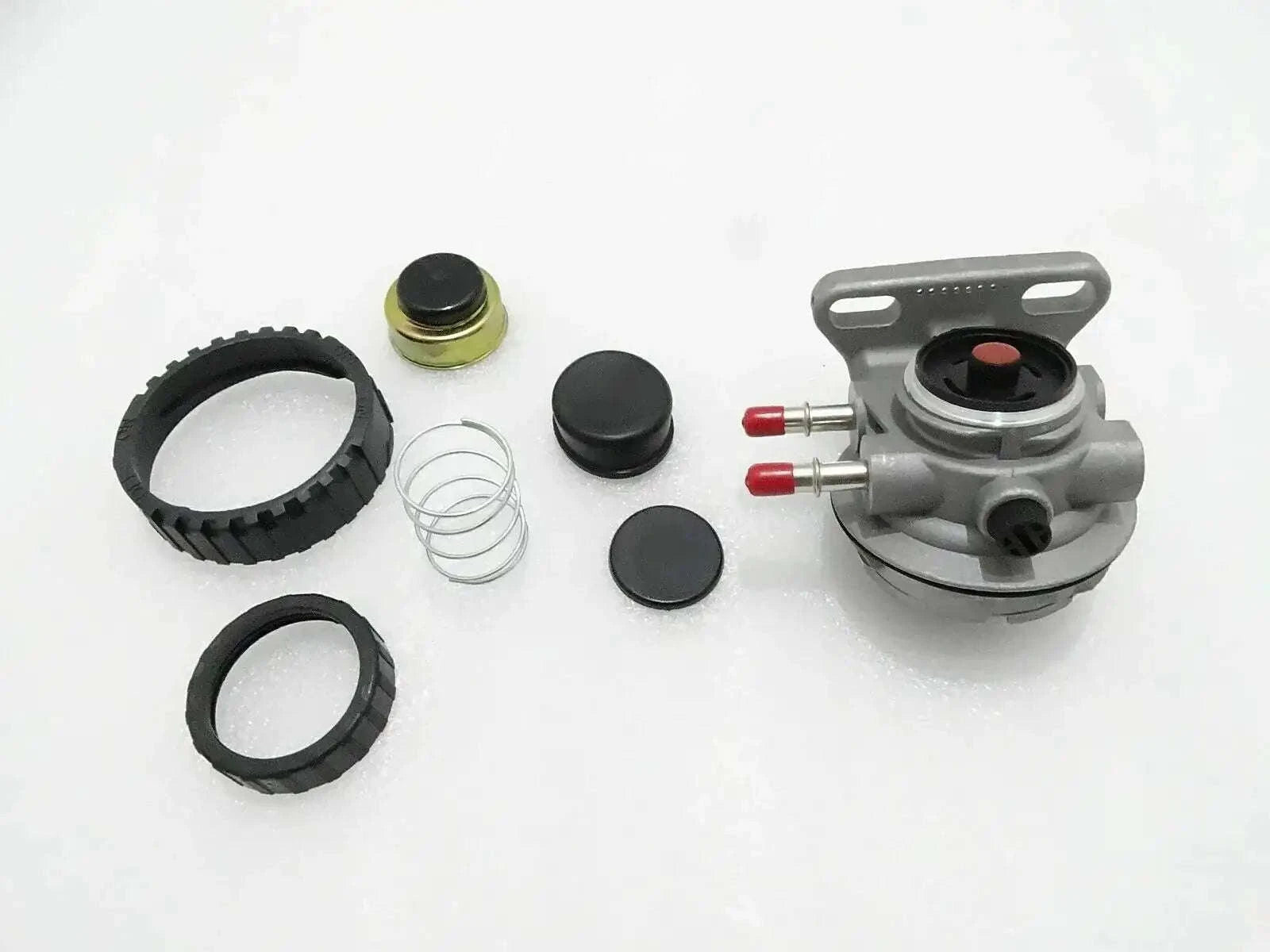 Hand primer kit components with pump head, fittings, rings, and spring