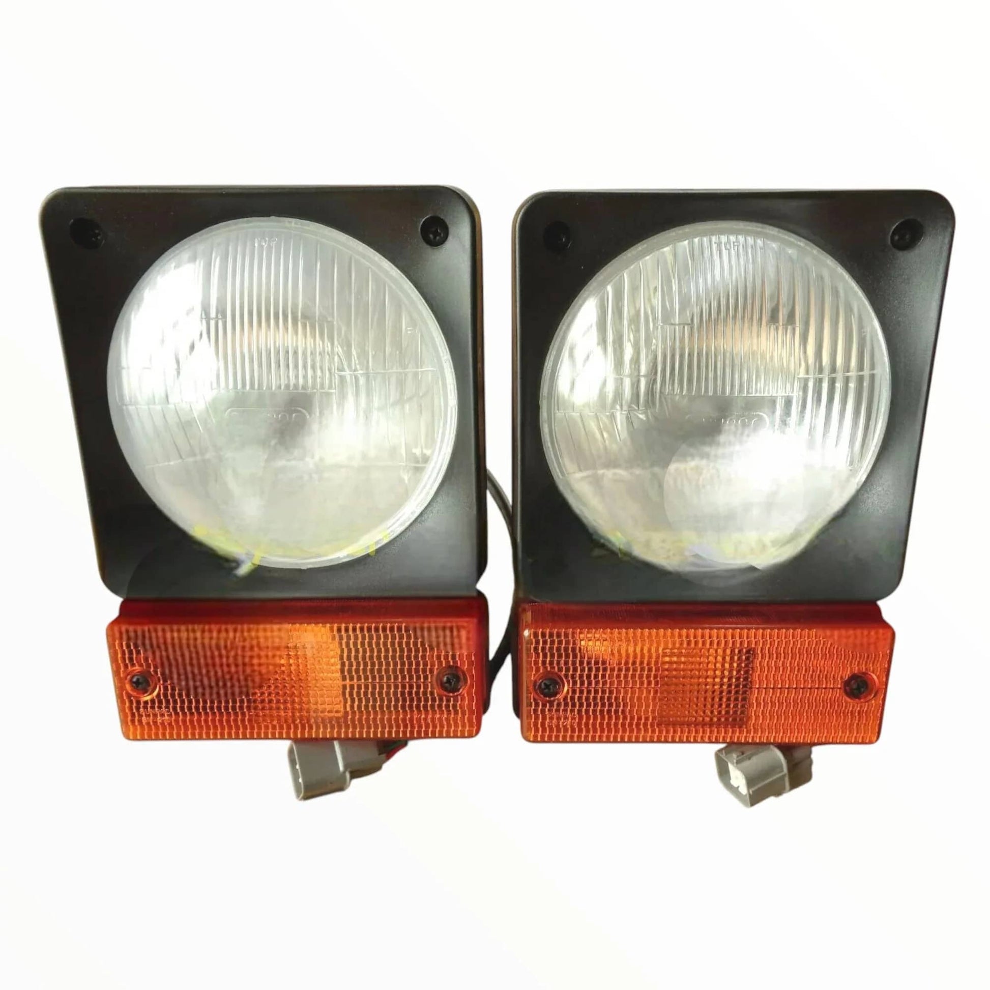 JCB headlamp assembly set featuring dual round headlights with orange side indicators