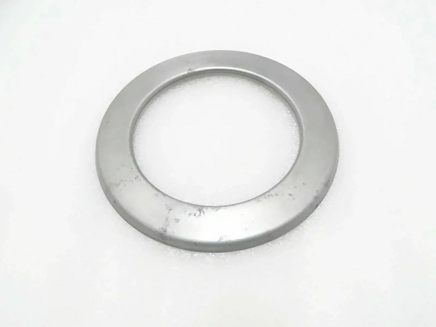 Circular metal hub seal cover with central opening, round flange