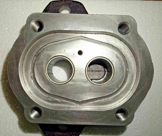 Hydraulic pump mounting flange with two threaded bolt holes and two port openings