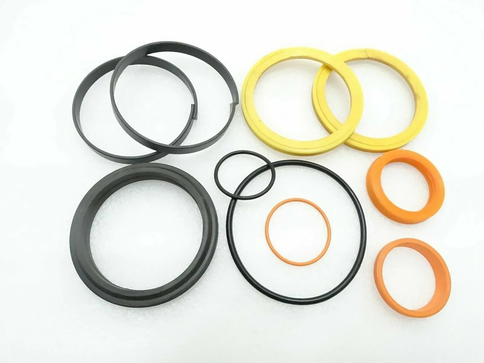 Hydraulic seal kit with O-ring seals, black, yellow, and orange rings