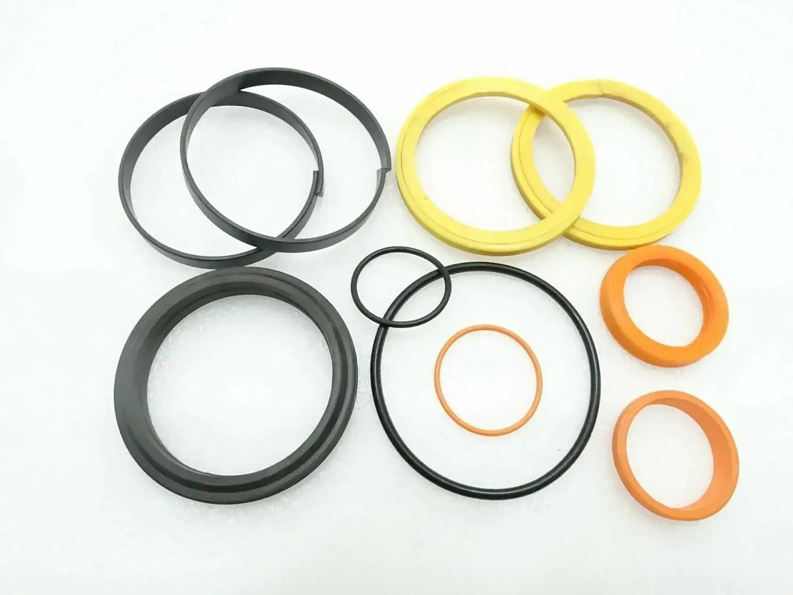 Hydraulic seal kit with O-ring seals, black, yellow, and orange rings