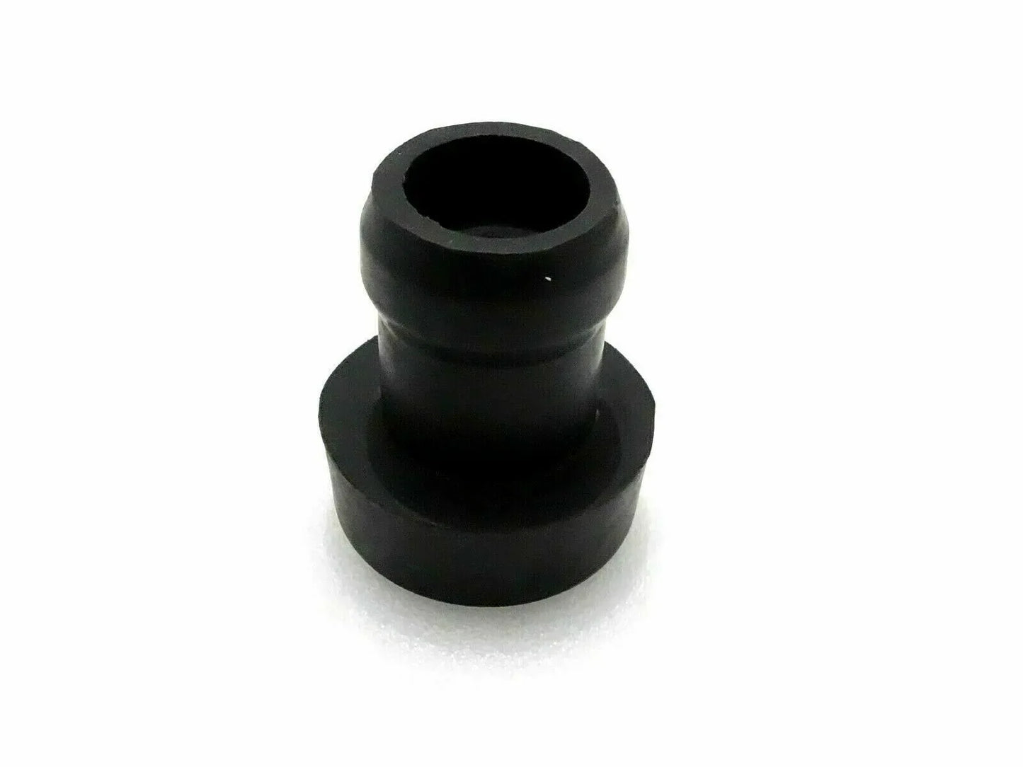 Black rubber cab mounting bushing with stepped cylindrical shape