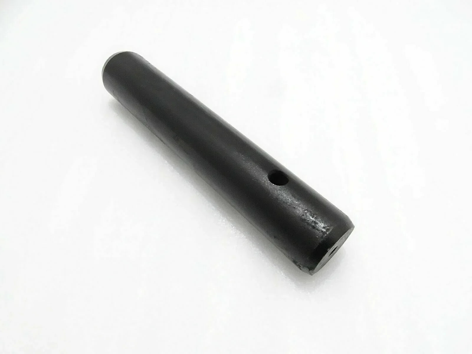 Black metal pin with side hole for mini digger attachment