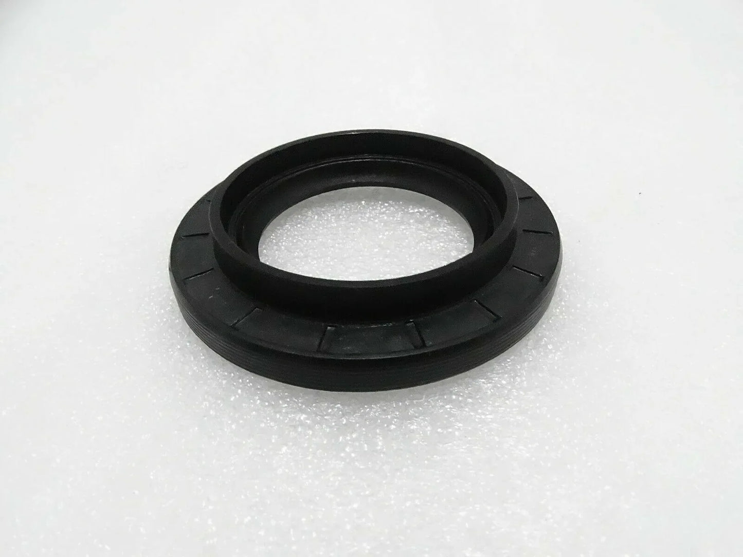 Black rubber oil seal ring with metal-reinforced lip