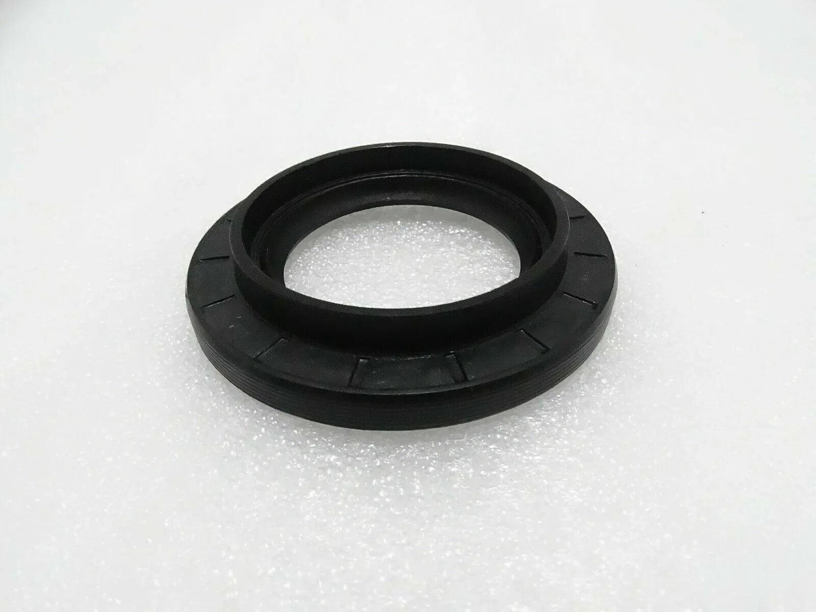 Black rubber oil seal ring with metal-reinforced lip