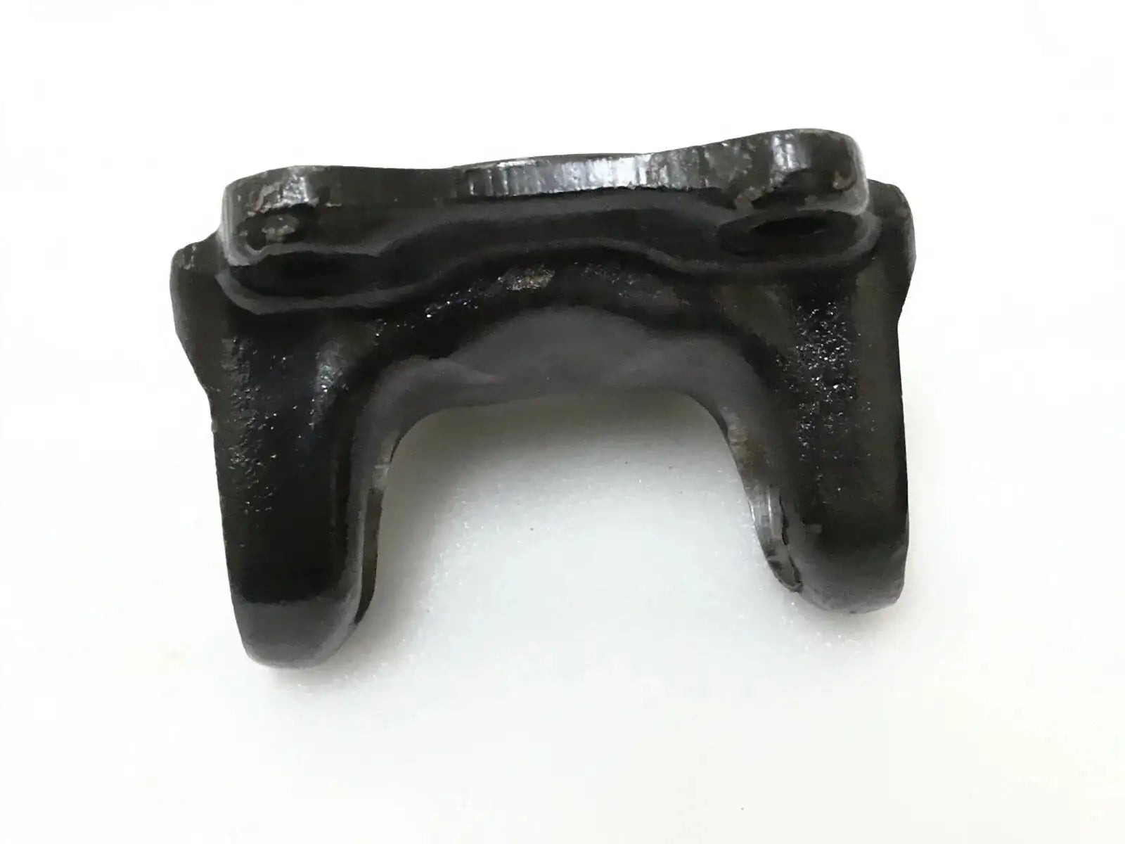 Metal flange yoke bracket with U-shaped opening and mounting tabs