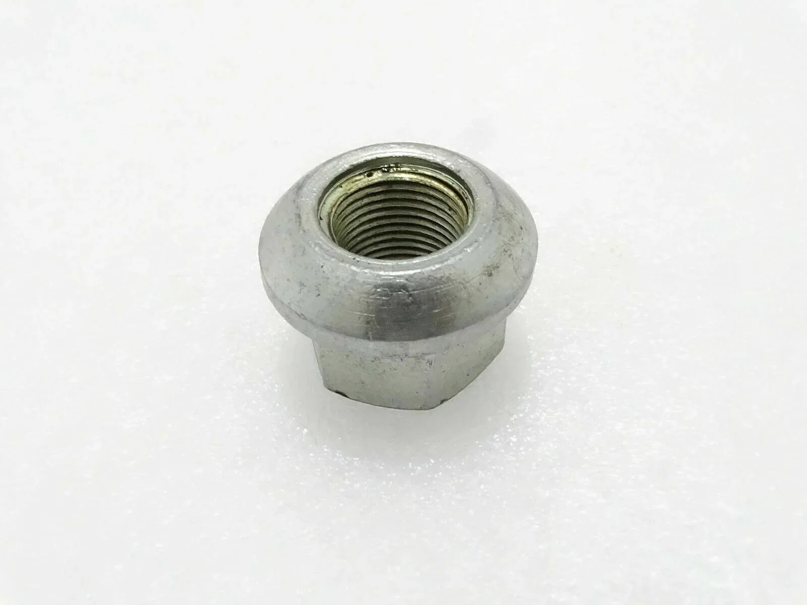 Metal hex wheel nut with threaded hole