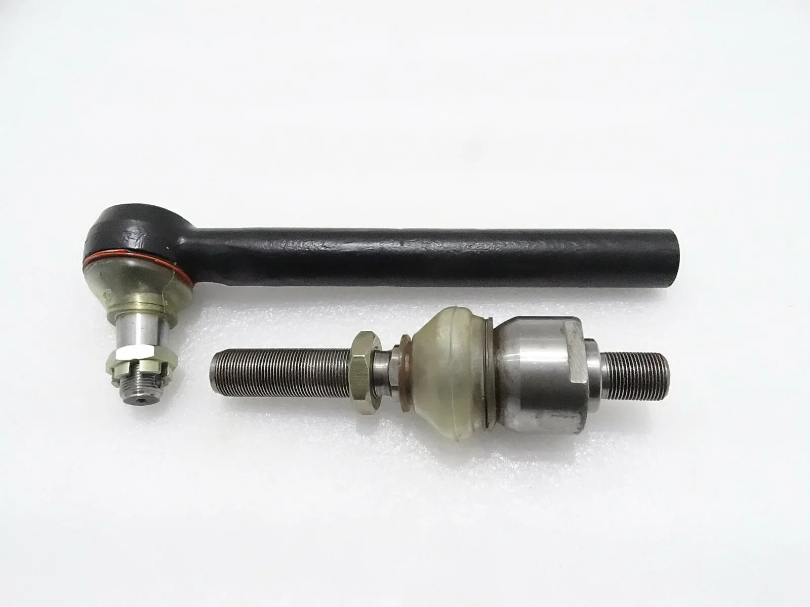 Track rod assembly with black rod and metal ball joint ends