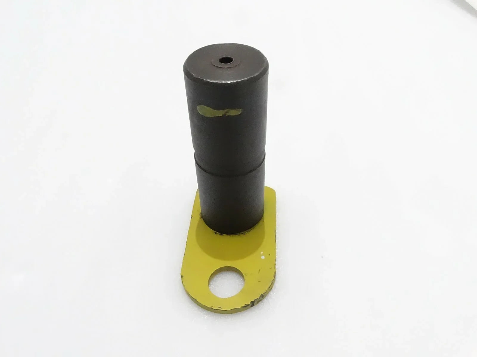 Metal shovel pin with yellow mounting plate and central hole