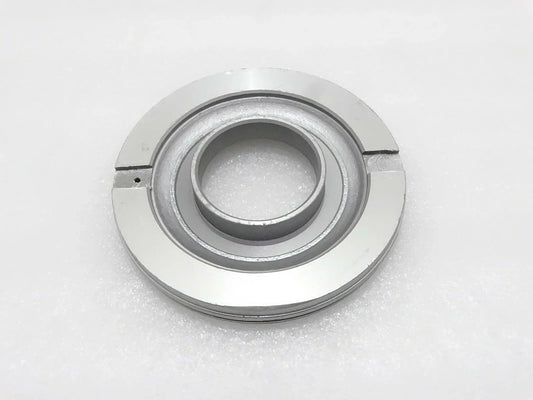 Metal piston assembly part with circular inner bore and outer ring, silver-gray