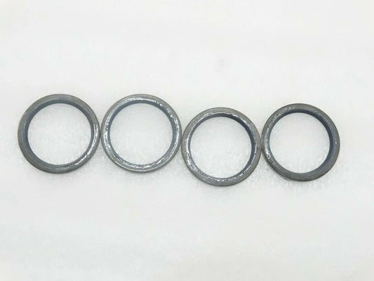 JCB seal pivot pin grease set, four durable metal rings for effective lubrication in machinery