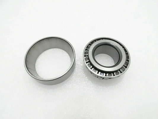 Thrust bearing with metal cage and roller assembly, shown with two rings