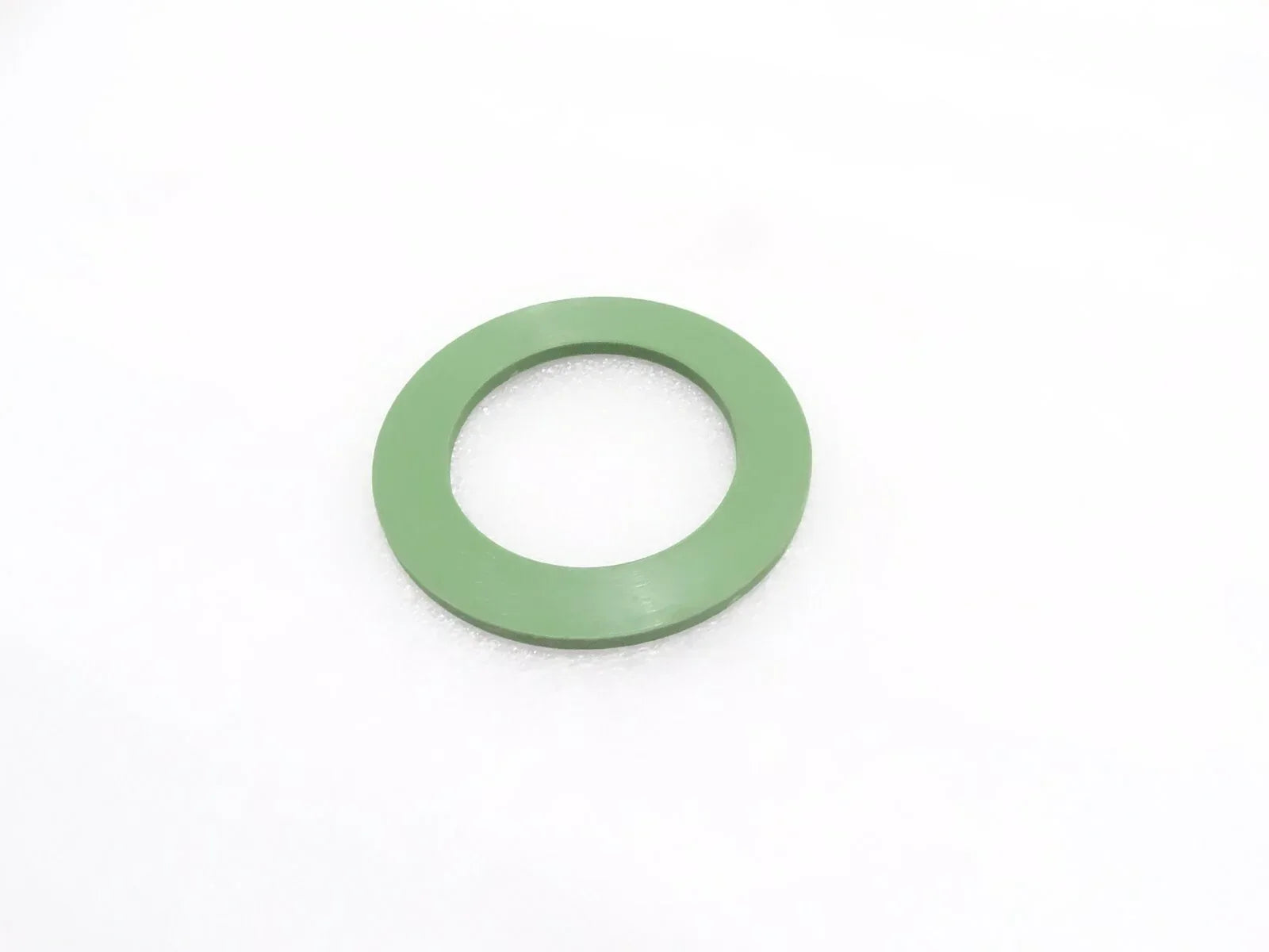 Green thrust washer with center hole for slew swing assemblies