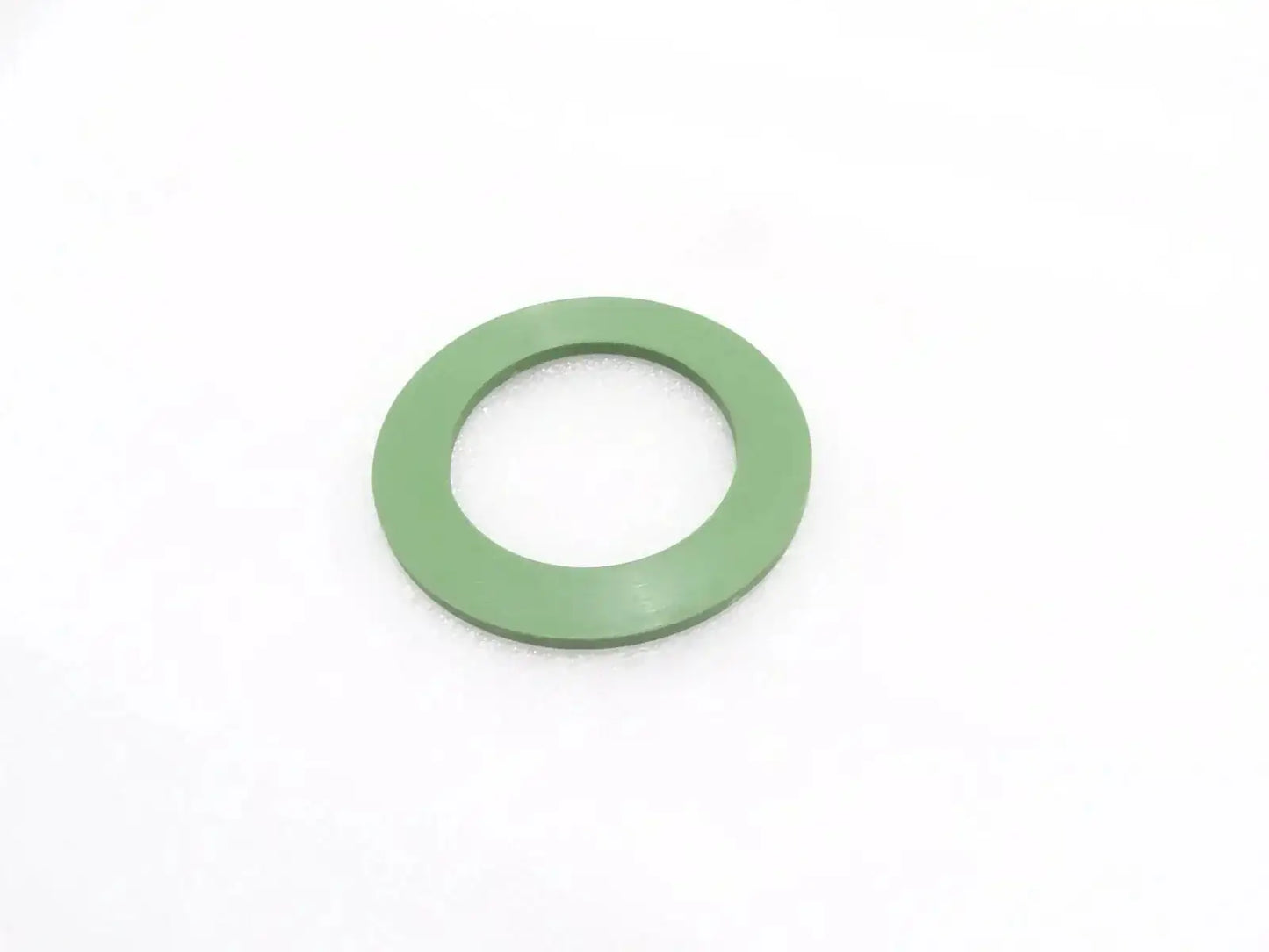 Green thrust washer with center hole for slew swing assemblies