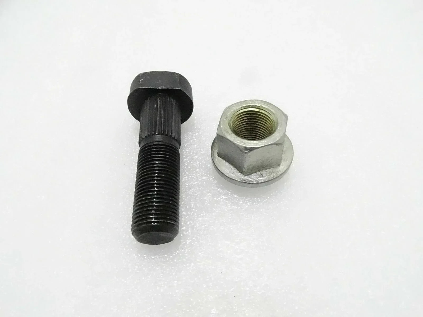 Wheel stud and wheel nut set with black threaded stud and silver hex nut