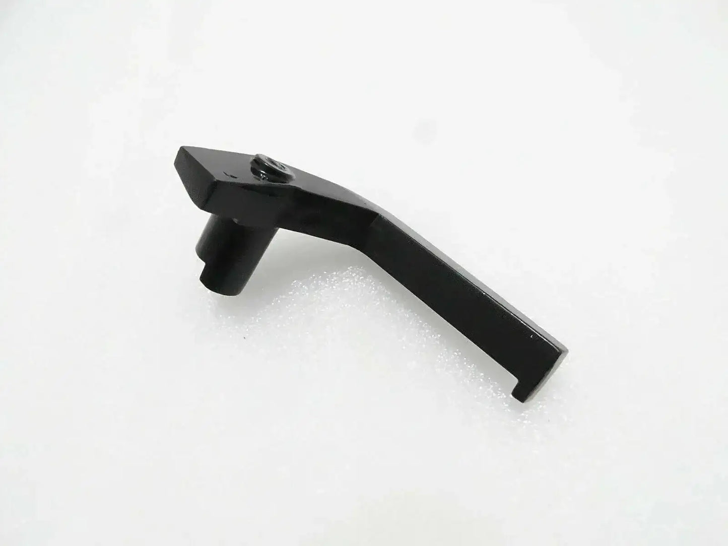 Left window handle, dark gray with mounting stud and screw hole