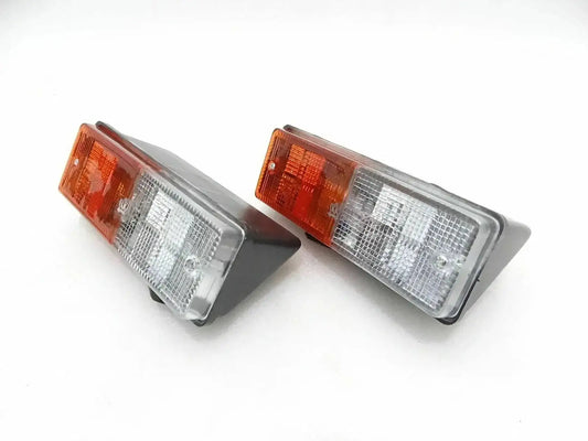 Pair of rear parking light assemblies with amber and clear rectangular lenses