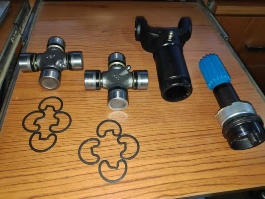 Rear propeller shaft yoke and UJ kit with cross joints, black covers, blue dust boot