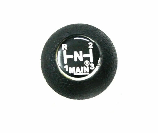 Black gear shift knob with circular gear-letter design showing R,2,N,H,1 and MAIN