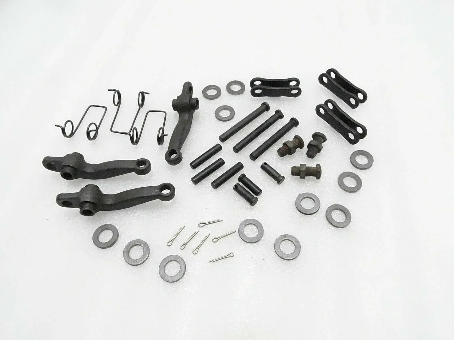 Tractor clutch kit components with pins, springs, bolts, and washers