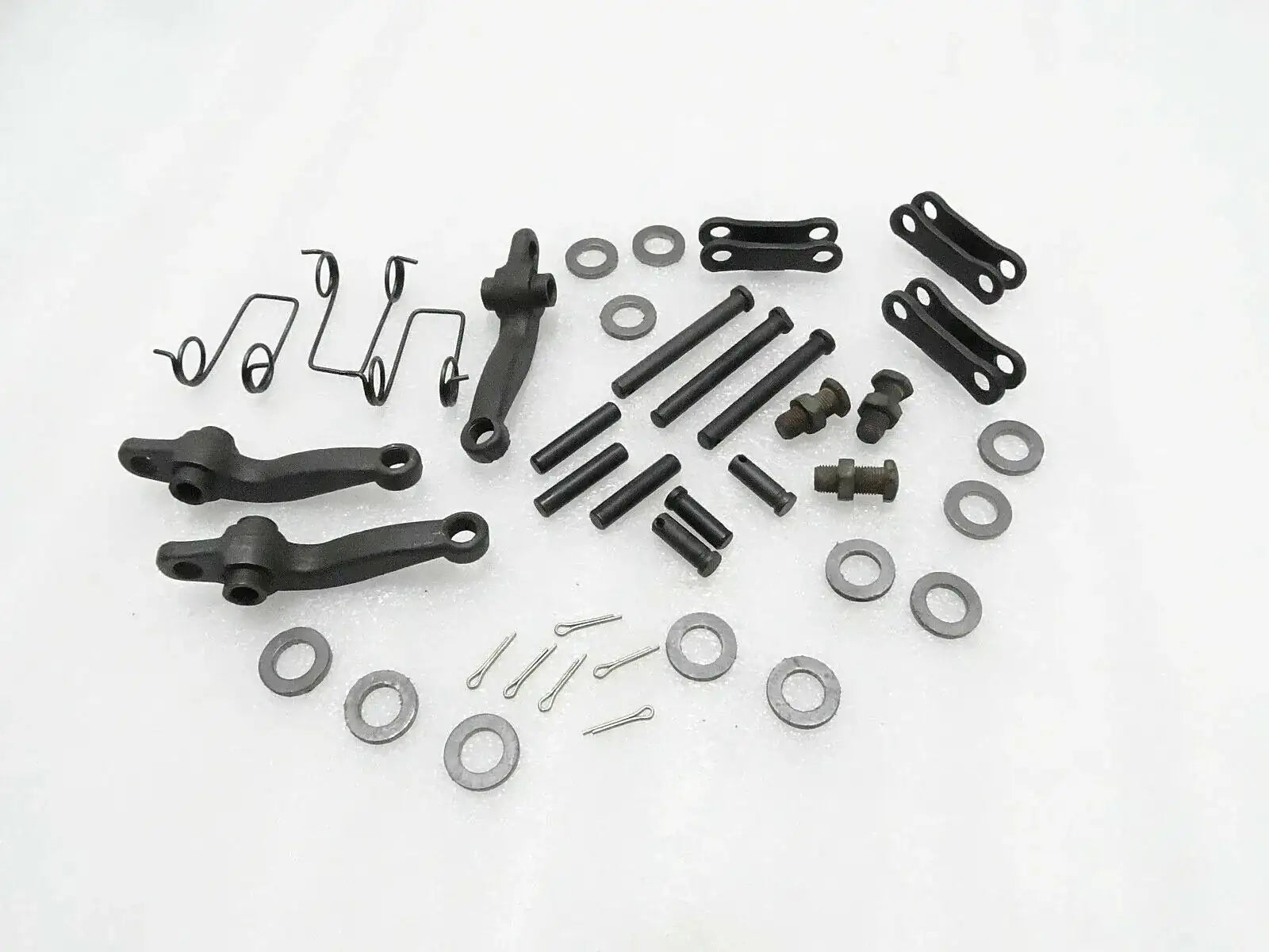 Tractor clutch kit components with pins, springs, bolts, and washers