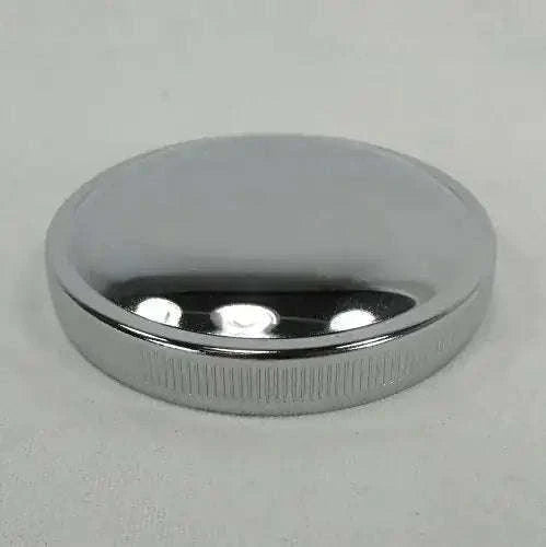 Chrome motorcycle gas tank cap with vented circular top and ridged edge