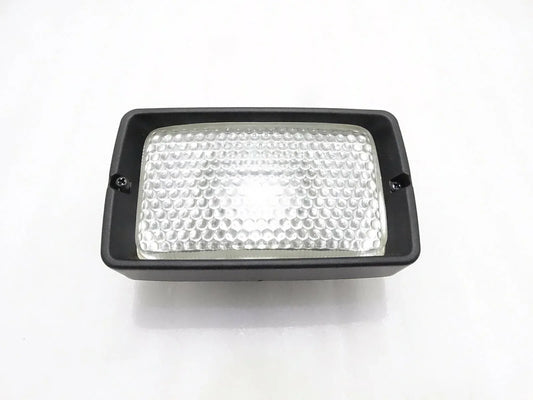 Front working light, rectangular black housing with clear textured lens