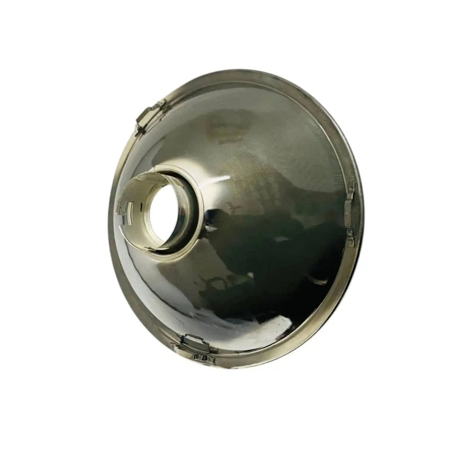 Sealed headlamp reflector with chrome housing and side bulb aperture, front view