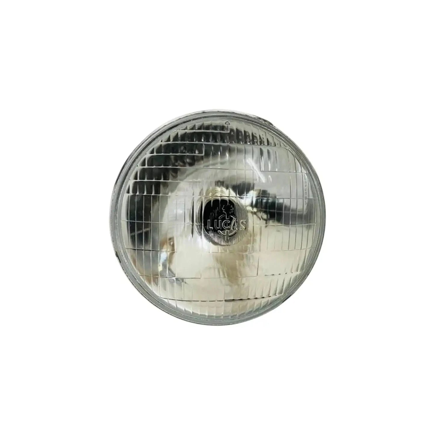 7-inch sealed headlamp with clear lens and chrome bezel, front grille and bulb center
