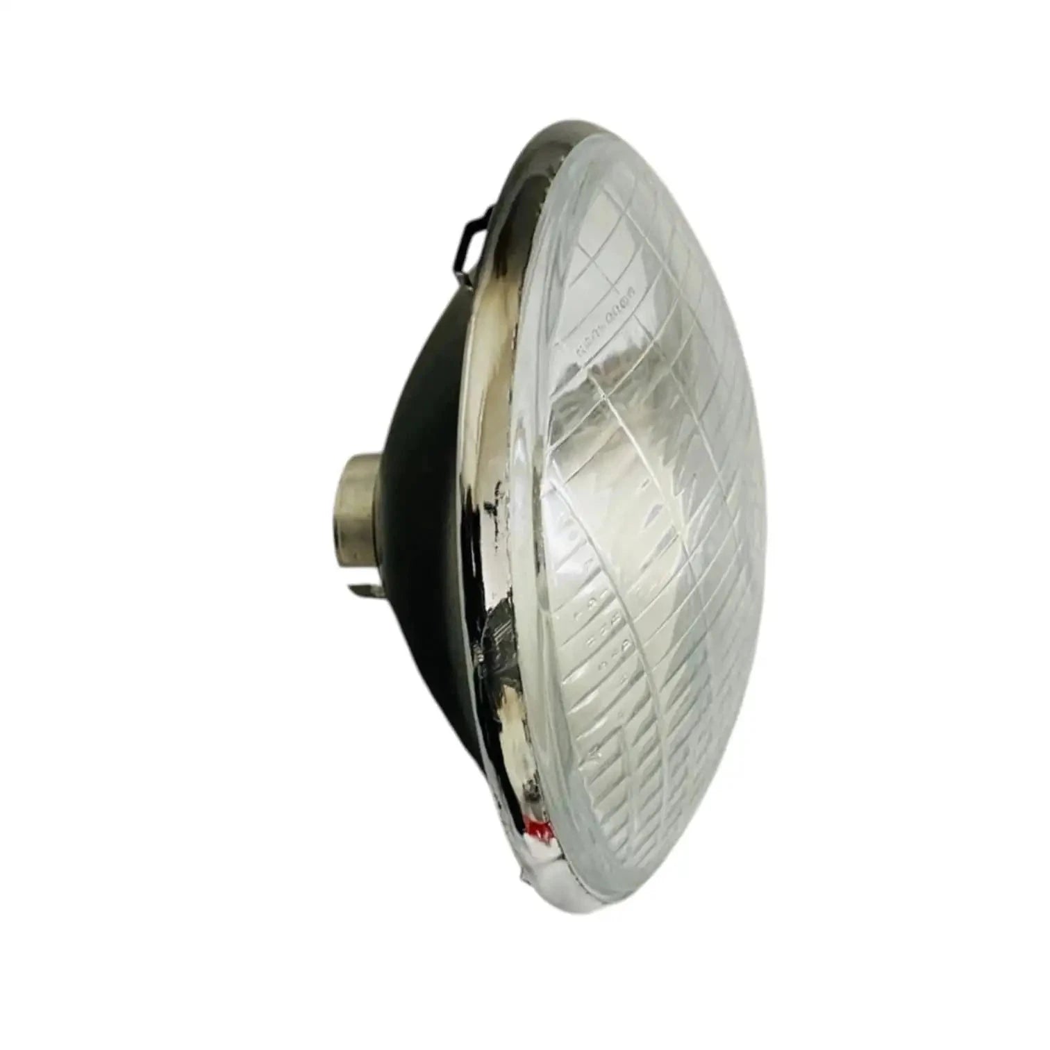 Sealed headlamp with clear lens and chrome housing, side profile and mounting tabs