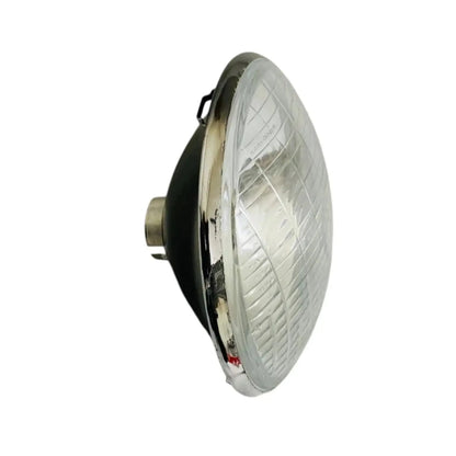 Sealed headlamp with clear lens and chrome housing, side profile and mounting tabs