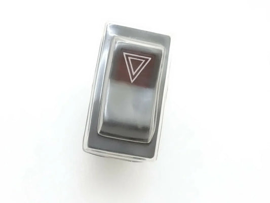 Hazard warning switch for Mahindra tractor, compact design for easy installation in vehicles.