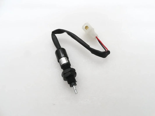 Brake light switch with coupler for Mahindra tractor, durable plastic, designed for reliable signaling