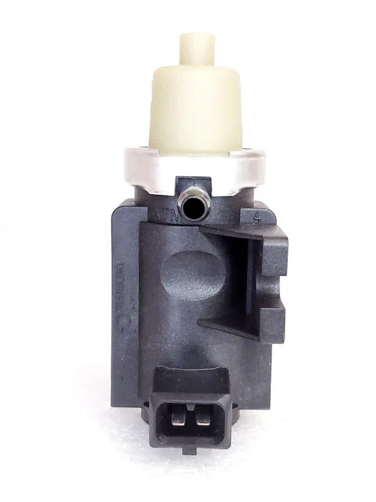 Vacuum modulator for Mahindra tractor, durable plastic, essential for engine performance.
