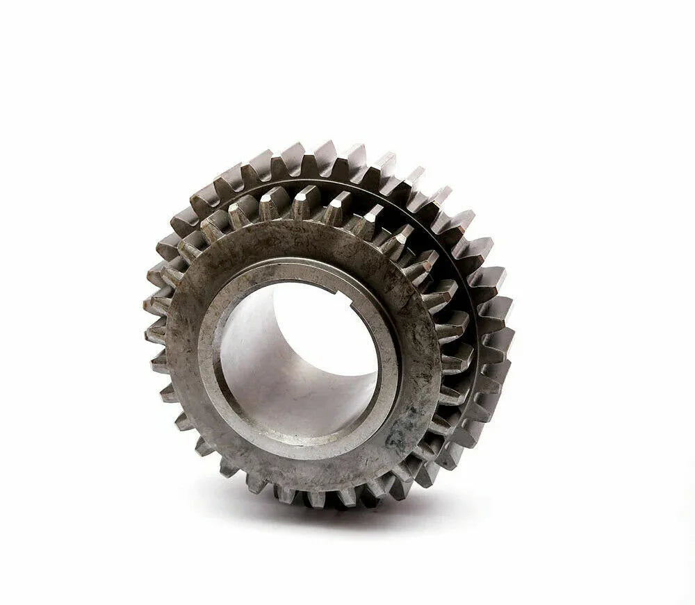 Metal tractor gear wheel with interlocking teeth and central bore
