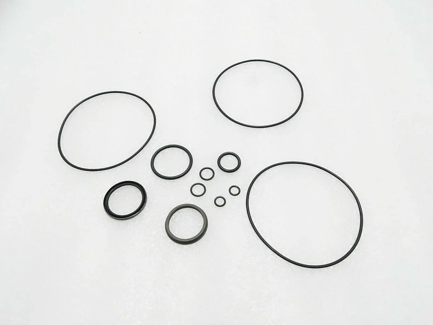 Tractor steering control unit seal kit with multiple circular gaskets and O-rings