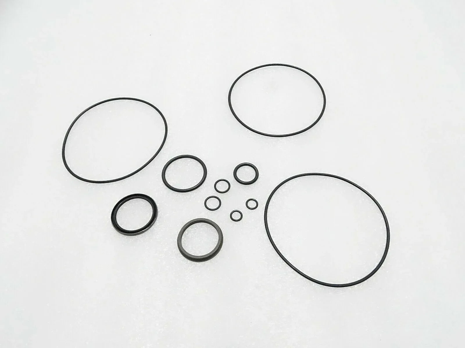 Tractor steering control unit seal kit with multiple circular gaskets and O-rings