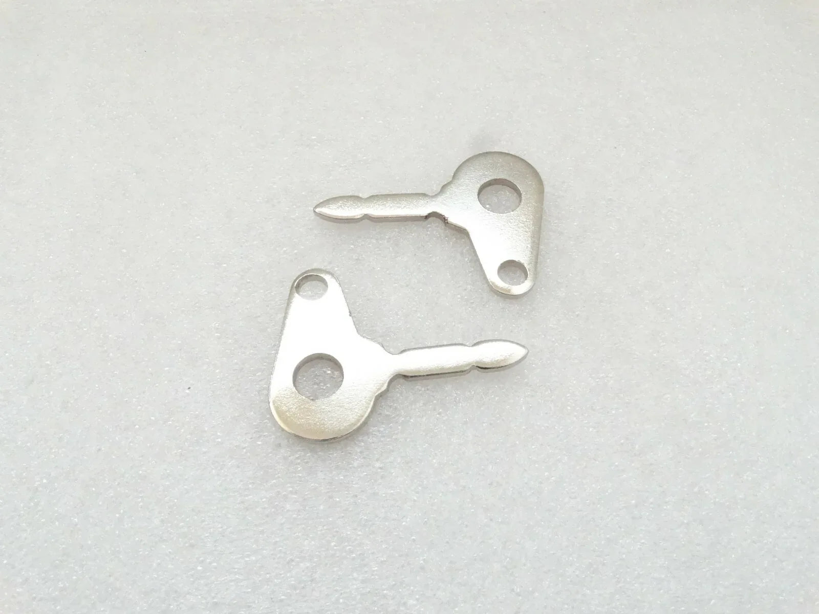 Ignition key blanks, two silver metal pieces