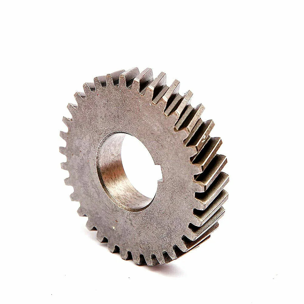 Metal crankshaft gear with central bore and outer gear teeth