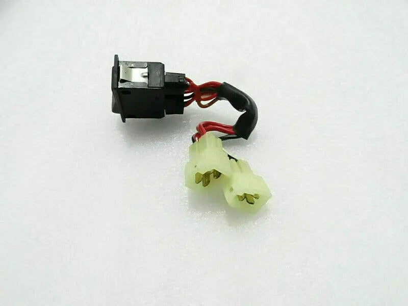Hazard switch with black housing, red/black wires, and yellow plastic connector