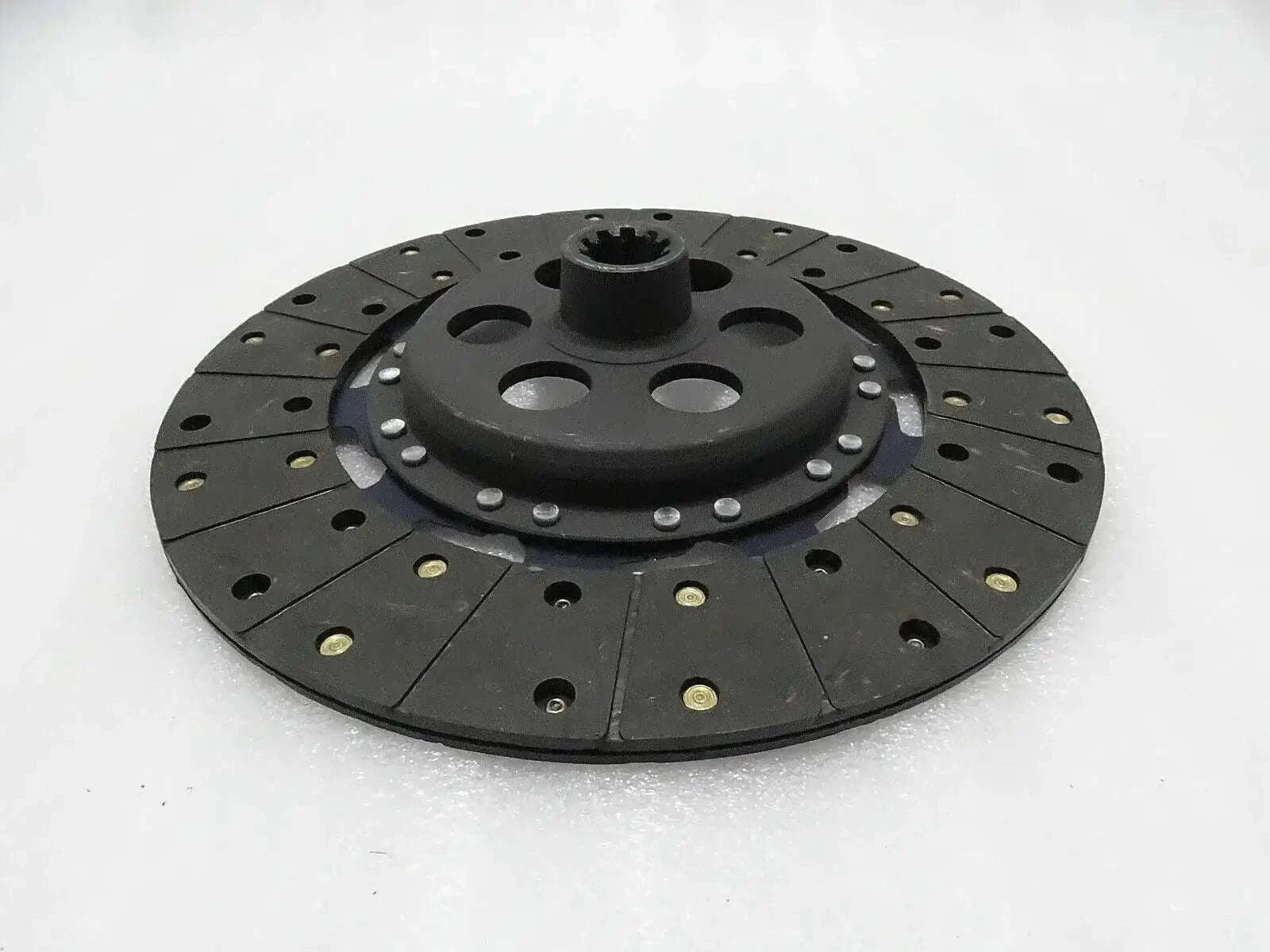 Black circular clutch plate with center splined hub and bolt holes