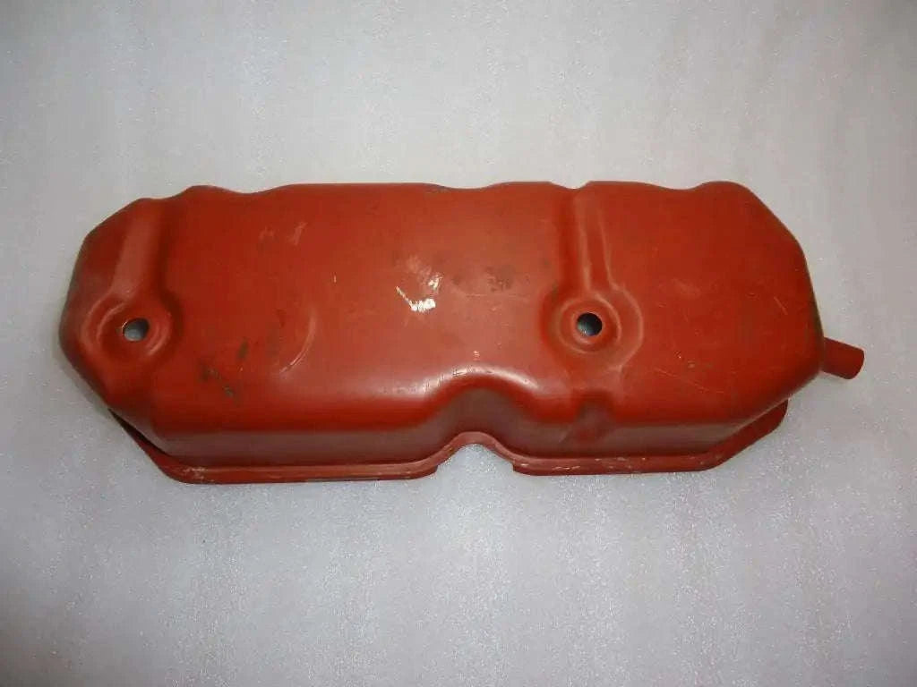 Red cylinder head cover with two mounting holes and raised gasket edge
