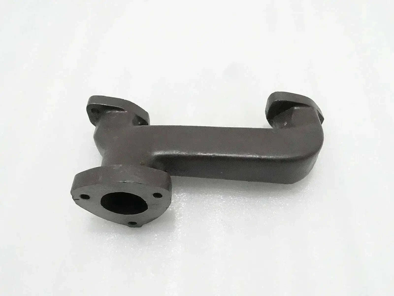 Dark gray silencer manifold with mounting flange and outlet pipe