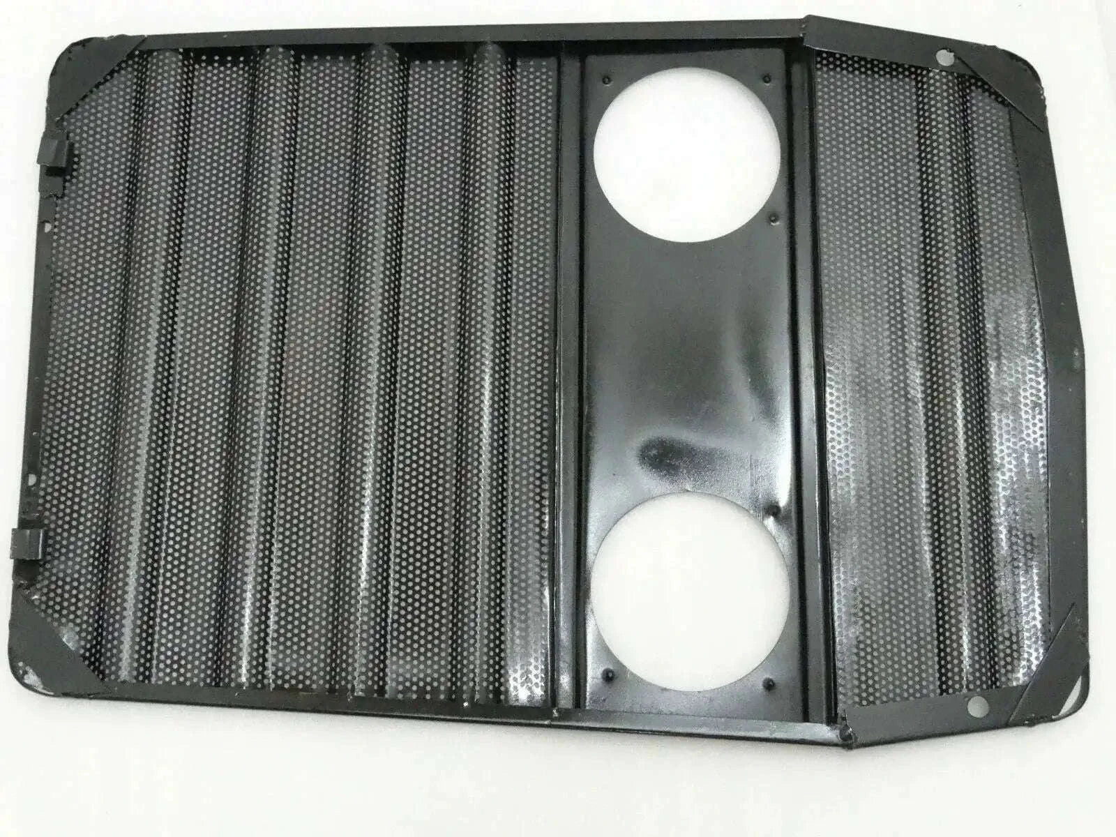 Massey Ferguson bonnet grill with two round openings, black metal mesh center