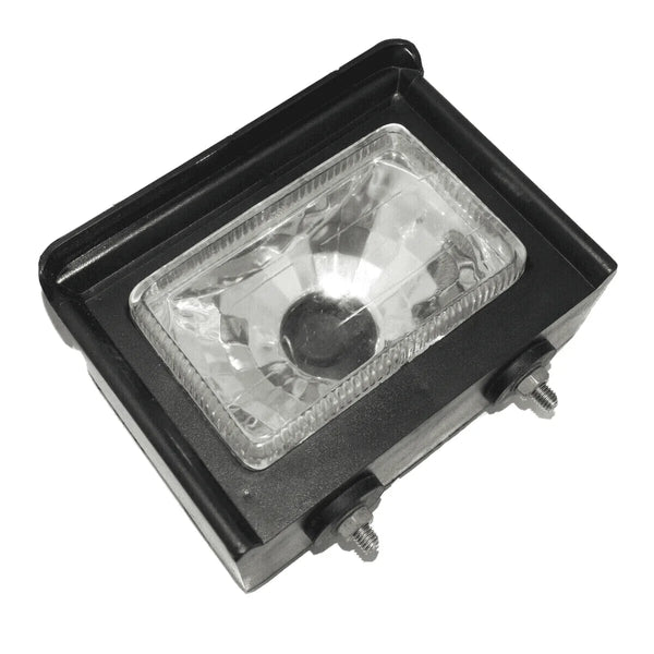 Headlight lamp box with clear rectangular lens and mounting bolts, no bulb holder