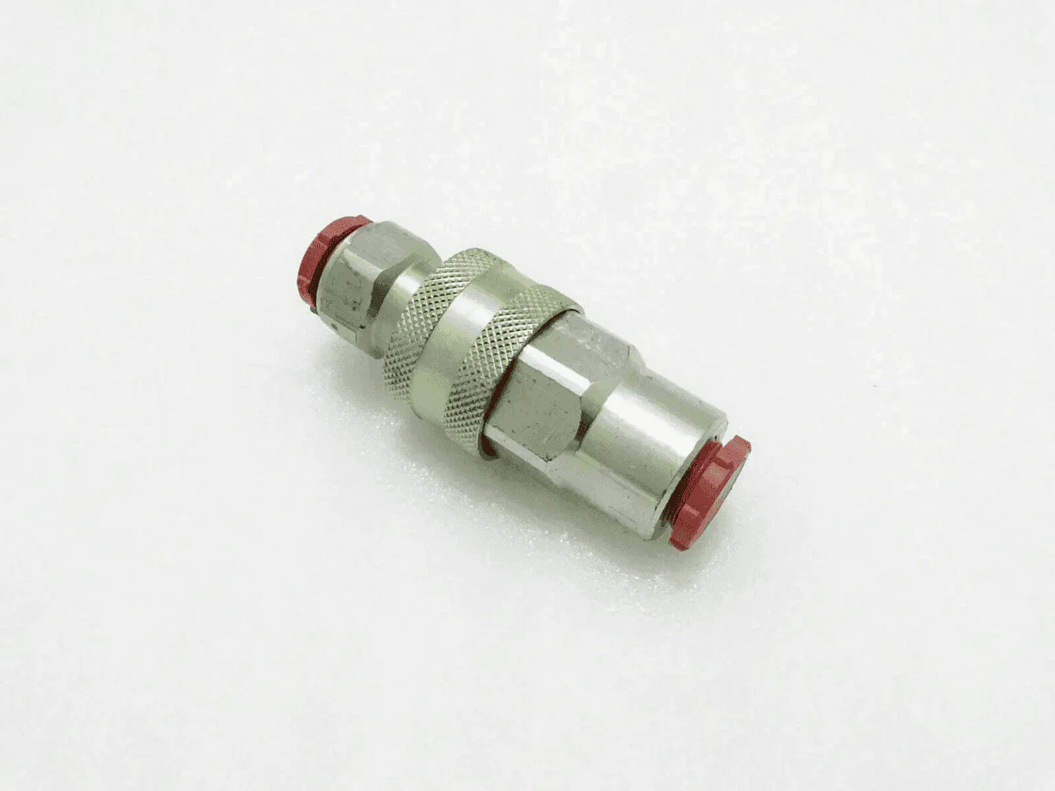 Massey Ferguson hydraulic coupling, metal, 1/2 inch, used for connecting hydraulic hoses.