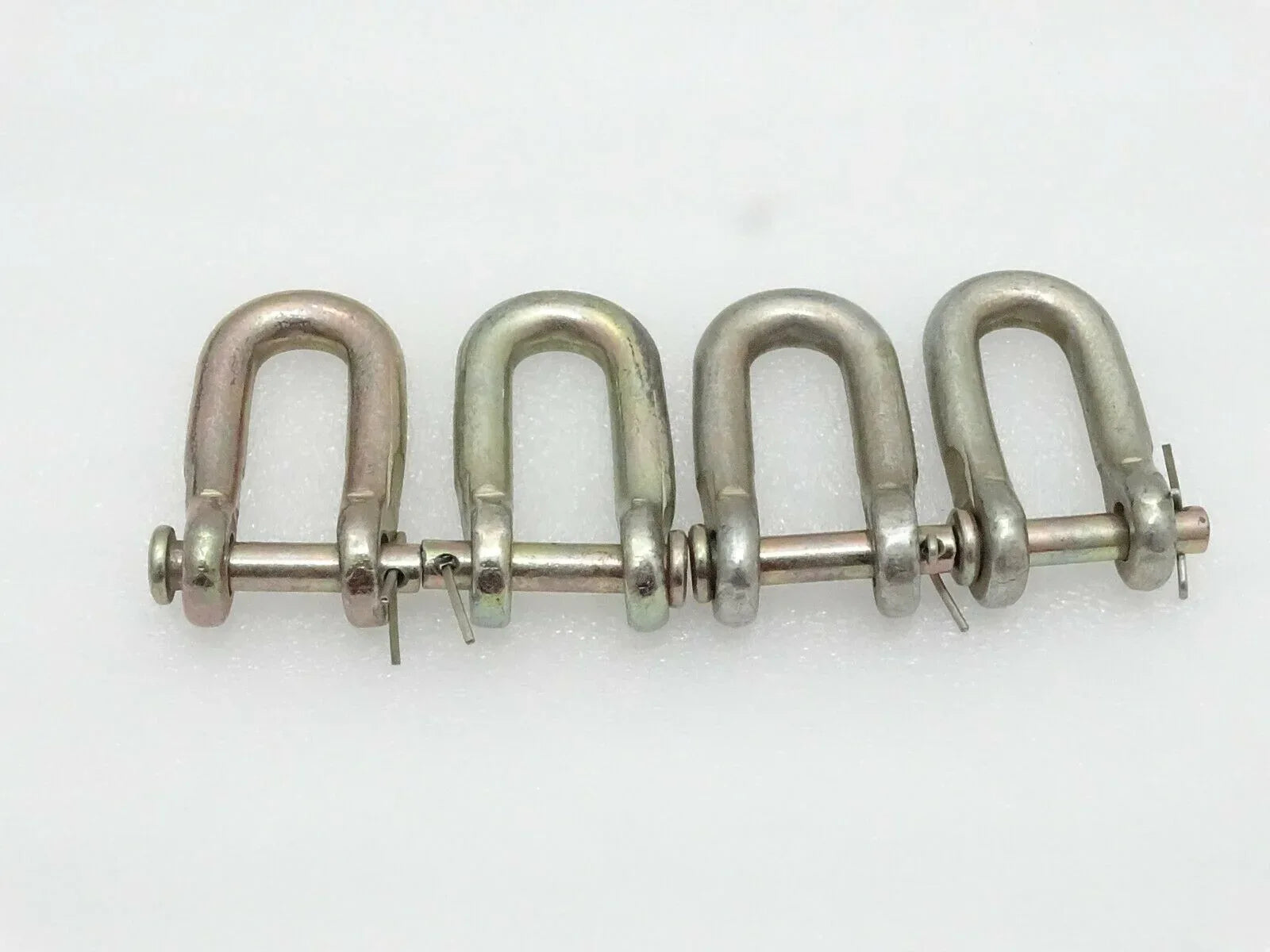 Check Chain D-Shackles set of 4, durable steel, used for securing loads in Massey Ferguson model equipment.
