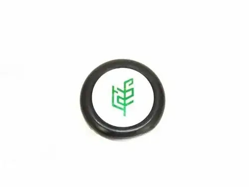 Black steering wheel cap with green Tafe logo on cream center